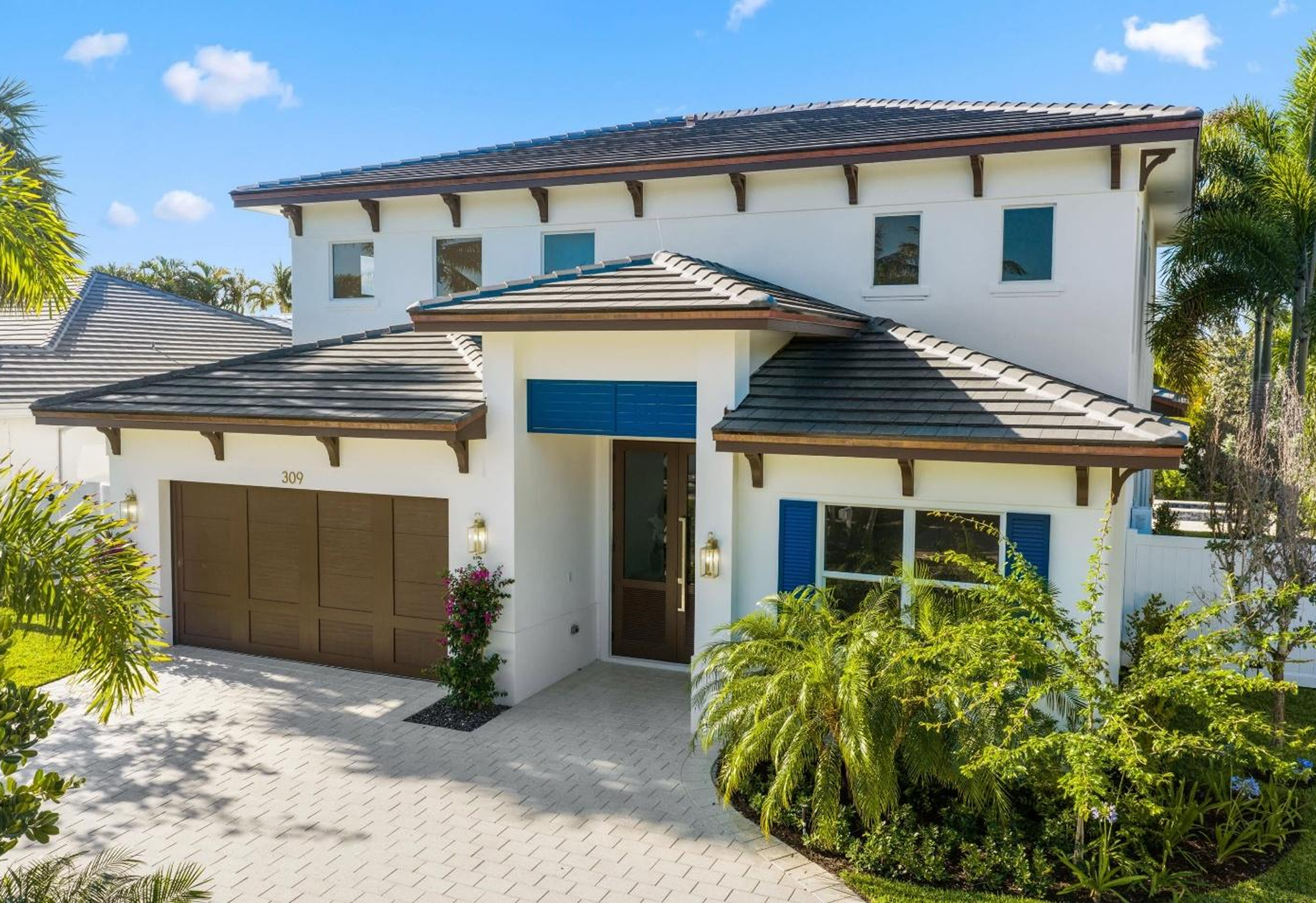 Two-story modern house with garage.