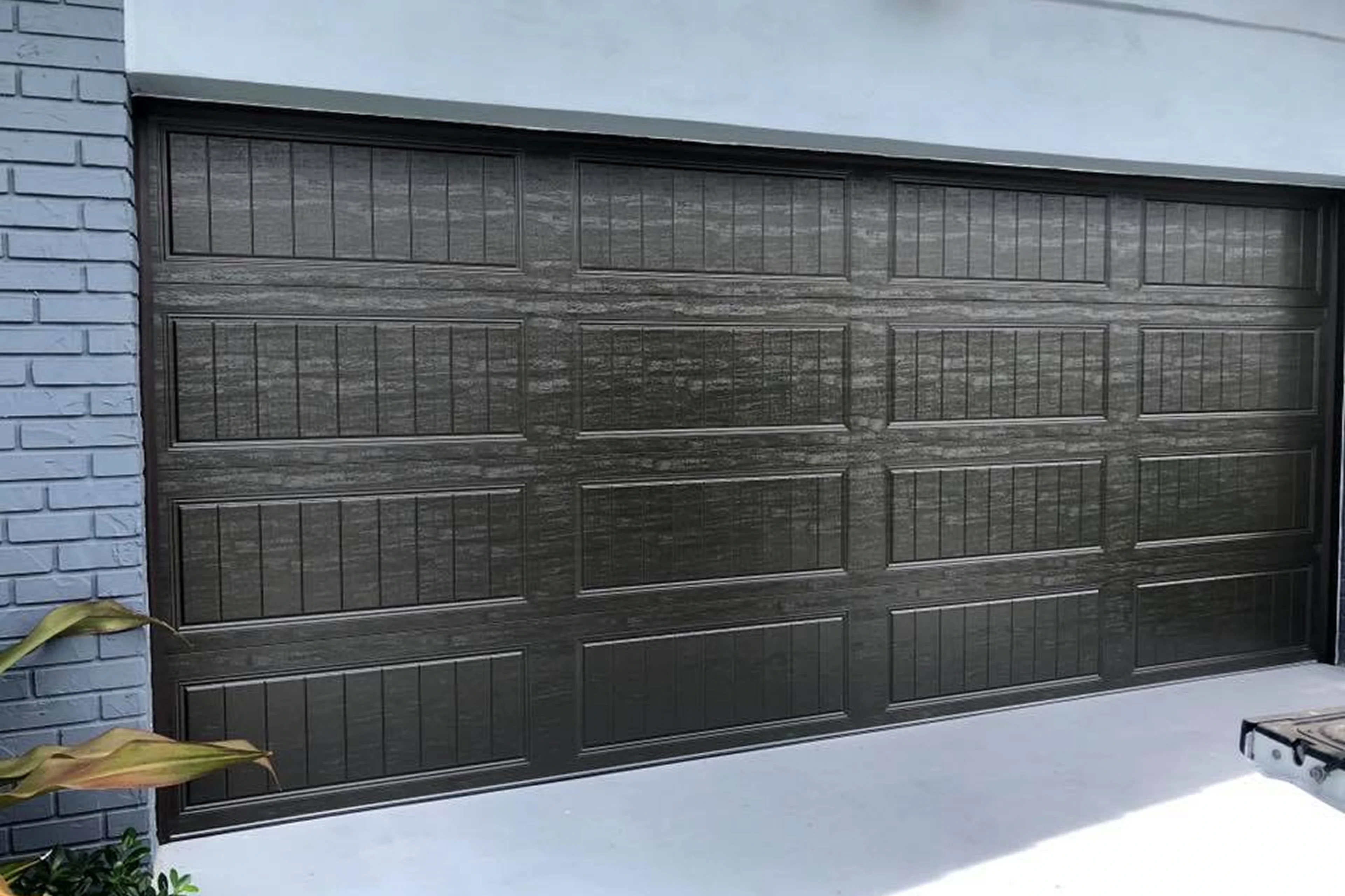 Closed garage door on brick building