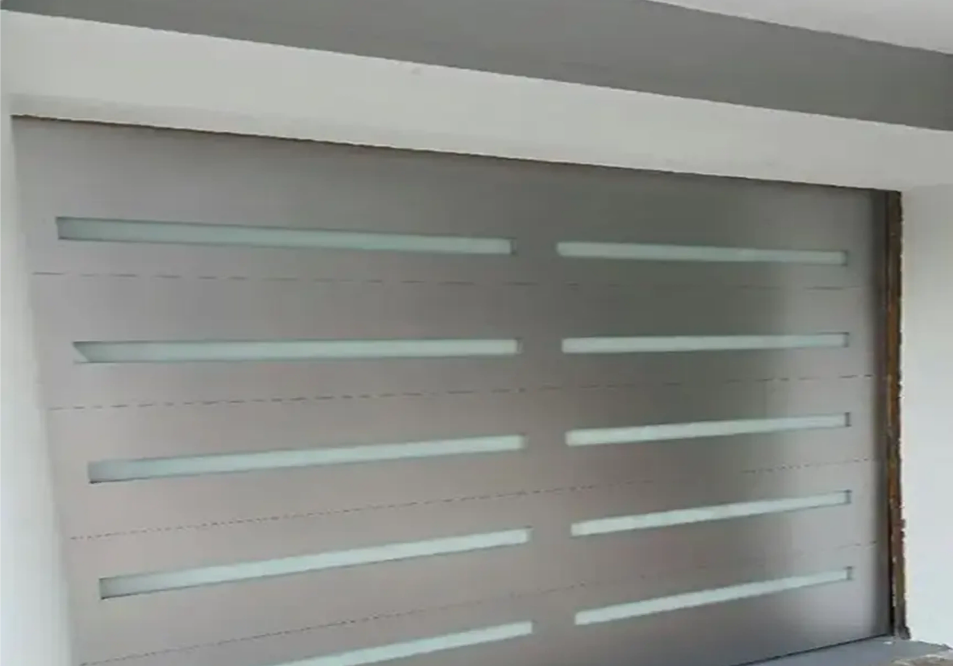 Contemporary garage door with glass panels